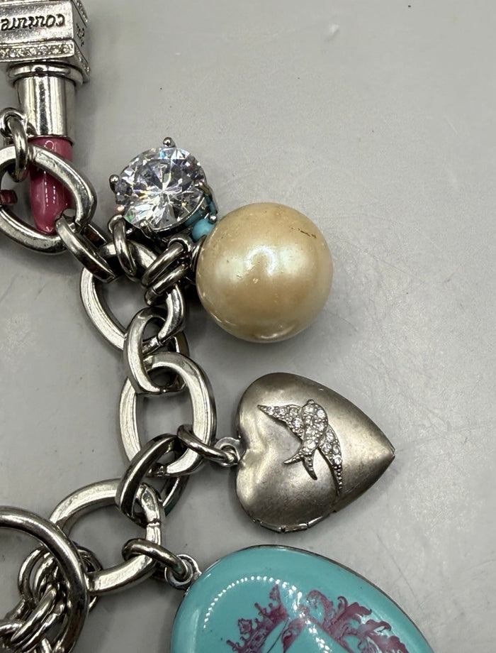 Vintage Juicy Couture silver-tone chunky charm bracelet with strawberry locket, horseshoe, pearl, heart, crystal and turquoise charms