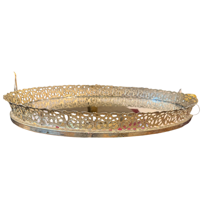 Decorative gold metal tray on a white background
