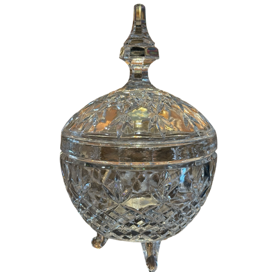 Decorative crystal container with a lid on a white background